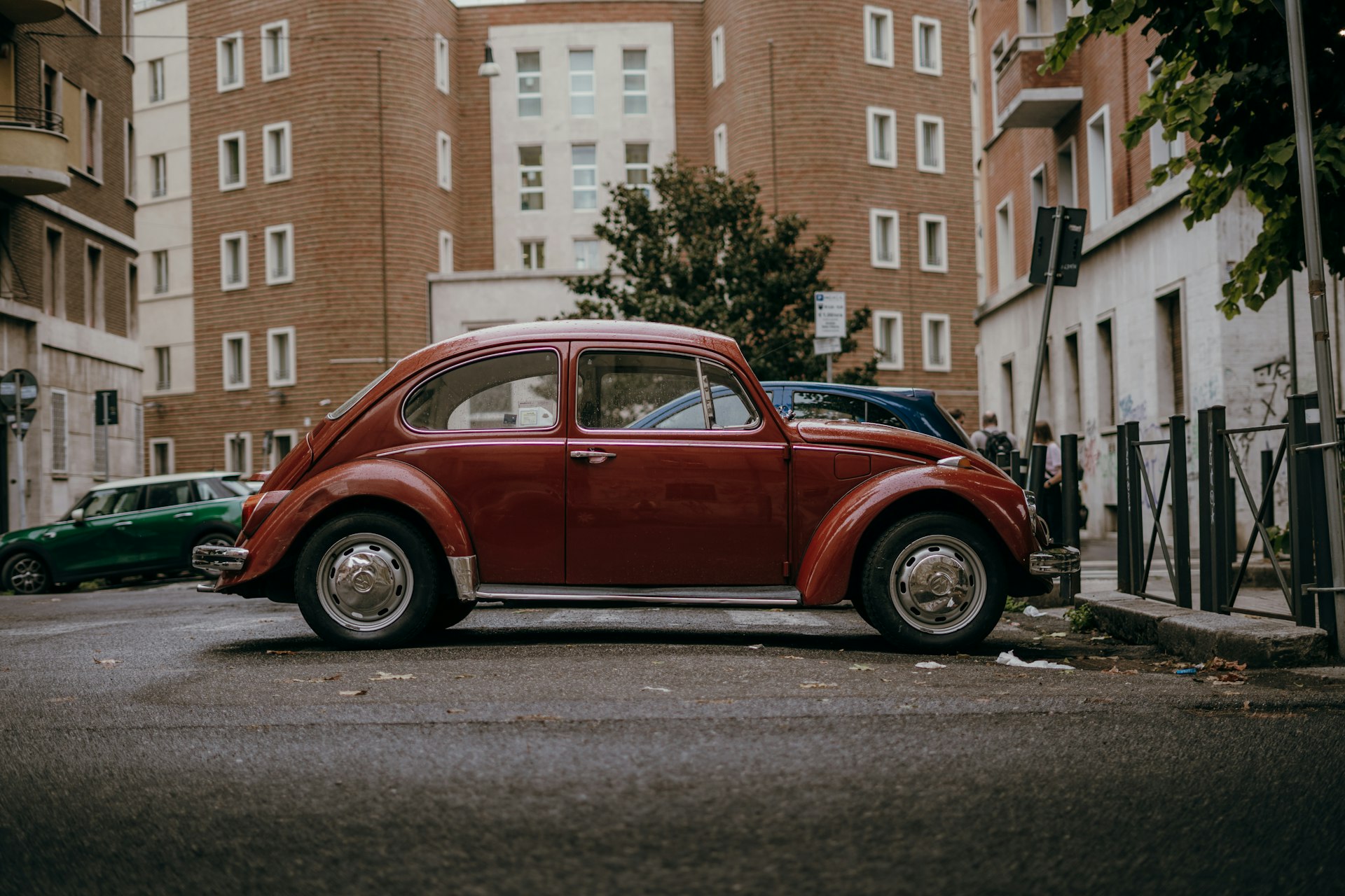 a red car parked on the side of the road